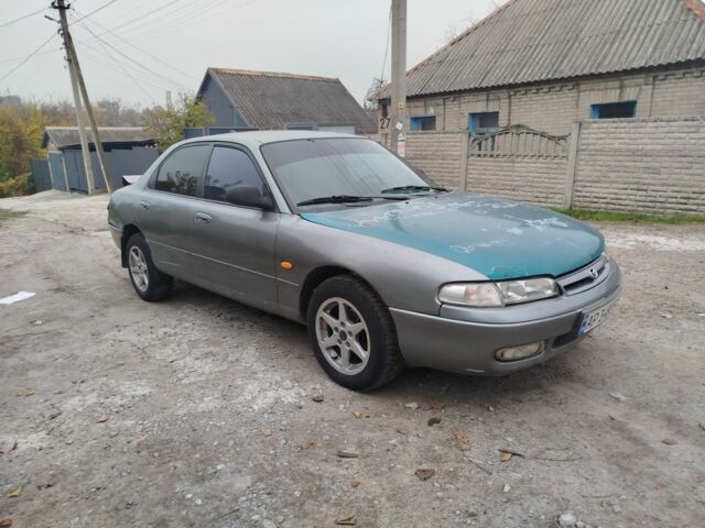 Серый Мазда 626, объемом двигателя 2 л и пробегом 100 тыс. км за 1000 $, фото 1 на Automoto.ua