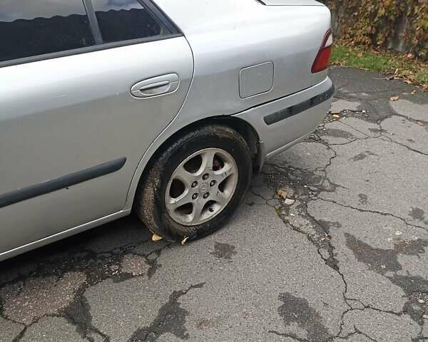 Серый Мазда 626, объемом двигателя 2 л и пробегом 320 тыс. км за 2630 $, фото 2 на Automoto.ua