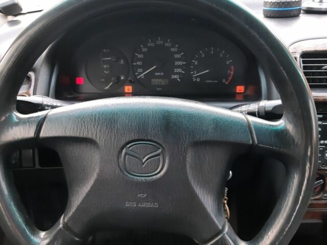 Серый Мазда 626, объемом двигателя 1.8 л и пробегом 225 тыс. км за 1200 $, фото 7 на Automoto.ua