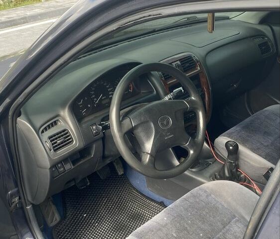 Сірий Мазда 626, об'ємом двигуна 2 л та пробігом 304 тис. км за 3500 $, фото 4 на Automoto.ua