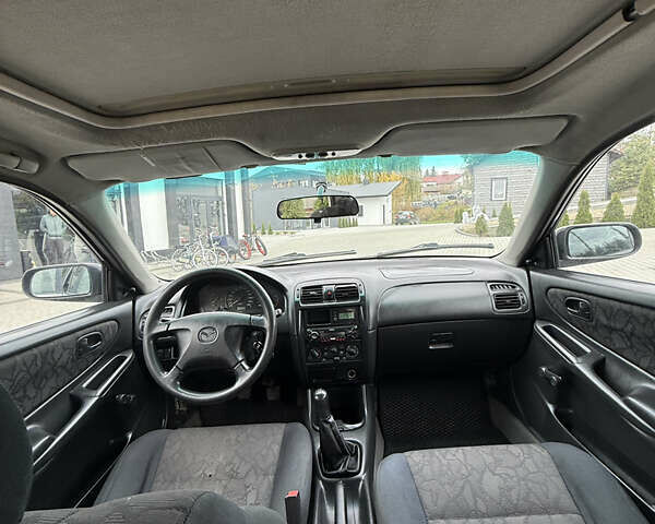 Сірий Мазда 626, об'ємом двигуна 1.8 л та пробігом 276 тис. км за 2000 $, фото 9 на Automoto.ua