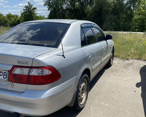 Серый Мазда 626, объемом двигателя 2 л и пробегом 300 тыс. км за 1349 $, фото 5 на Automoto.ua