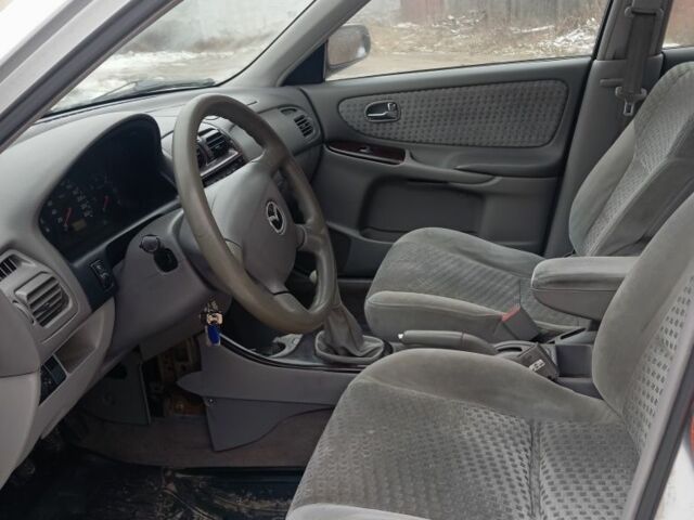 Серый Мазда 626, объемом двигателя 2 л и пробегом 371 тыс. км за 1900 $, фото 5 на Automoto.ua