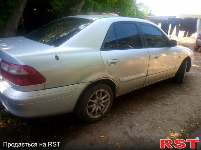 Серый Мазда 626, объемом двигателя 2 л и пробегом 301 тыс. км за 2750 $, фото 1 на Automoto.ua