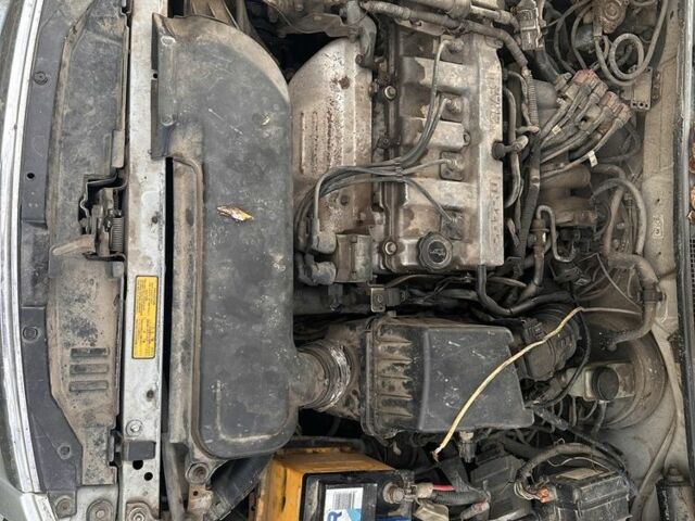 Серый Мазда 626, объемом двигателя 1.8 л и пробегом 200 тыс. км за 600 $, фото 3 на Automoto.ua