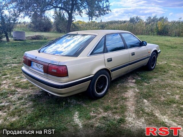 Серый Мазда 626, объемом двигателя 2 л и пробегом 370 тыс. км за 1950 $, фото 5 на Automoto.ua