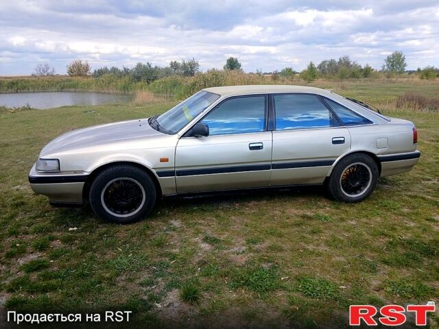 Серый Мазда 626, объемом двигателя 2 л и пробегом 370 тыс. км за 1950 $, фото 1 на Automoto.ua