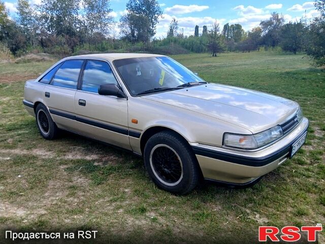 Серый Мазда 626, объемом двигателя 2 л и пробегом 370 тыс. км за 1950 $, фото 2 на Automoto.ua