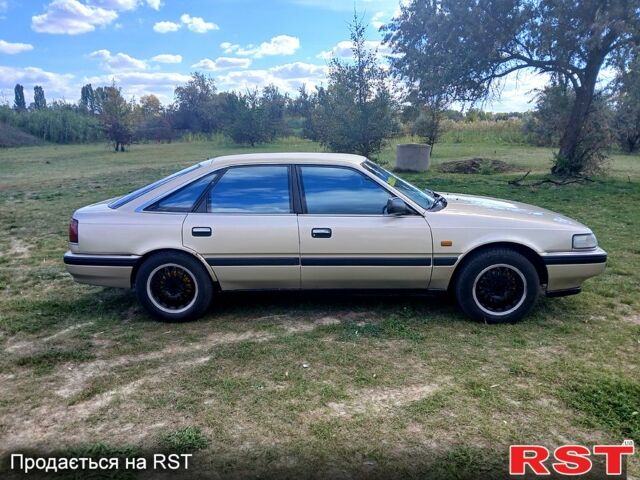 Серый Мазда 626, объемом двигателя 2 л и пробегом 370 тыс. км за 1950 $, фото 4 на Automoto.ua