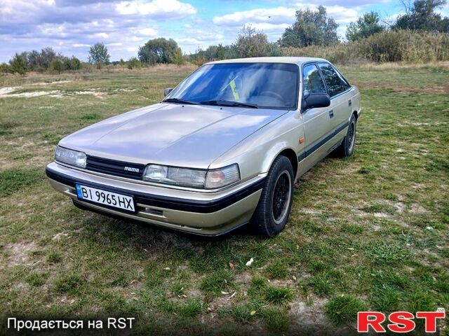 Серый Мазда 626, объемом двигателя 2 л и пробегом 370 тыс. км за 1950 $, фото 3 на Automoto.ua