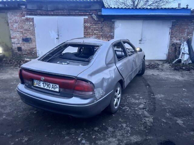 Серый Мазда 626, объемом двигателя 1.8 л и пробегом 100 тыс. км за 300 $, фото 2 на Automoto.ua