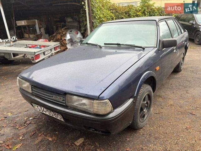 Синий Мазда 626, объемом двигателя 2 л и пробегом 400 тыс. км за 700 $, фото 2 на Automoto.ua