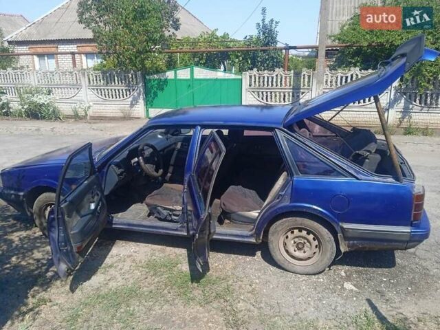 Синій Мазда 626, об'ємом двигуна 1.8 л та пробігом 354 тис. км за 1000 $, фото 2 на Automoto.ua