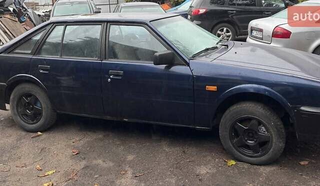Синий Мазда 626, объемом двигателя 2 л и пробегом 400 тыс. км за 700 $, фото 3 на Automoto.ua