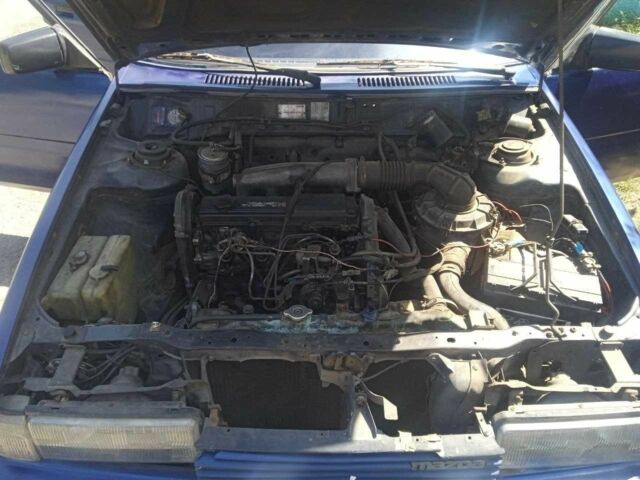 Синий Мазда 626, объемом двигателя 1.8 л и пробегом 354 тыс. км за 1000 $, фото 4 на Automoto.ua