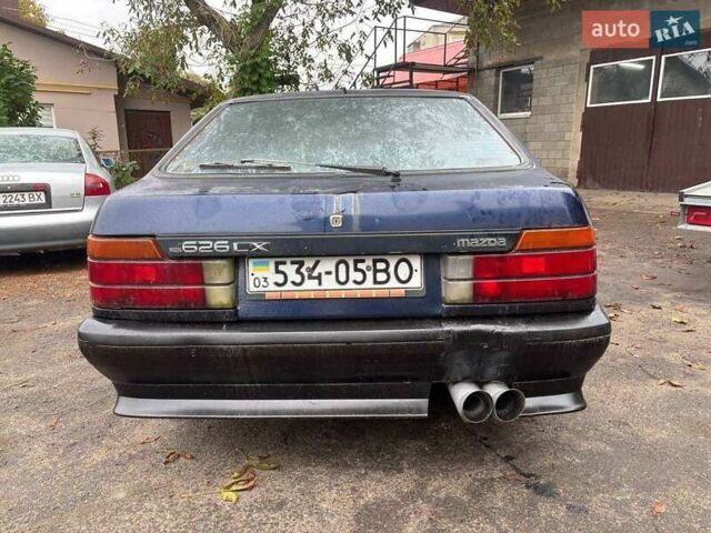 Синий Мазда 626, объемом двигателя 2 л и пробегом 400 тыс. км за 700 $, фото 1 на Automoto.ua