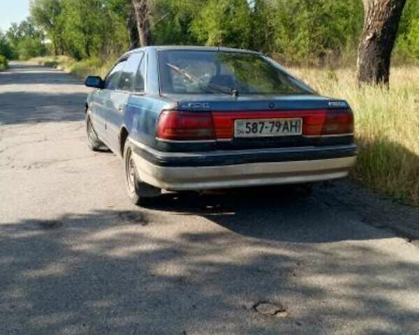 Синий Мазда 626, объемом двигателя 2 л и пробегом 300 тыс. км за 650 $, фото 2 на Automoto.ua