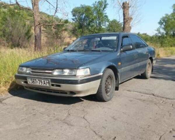 Синий Мазда 626, объемом двигателя 2 л и пробегом 300 тыс. км за 650 $, фото 4 на Automoto.ua