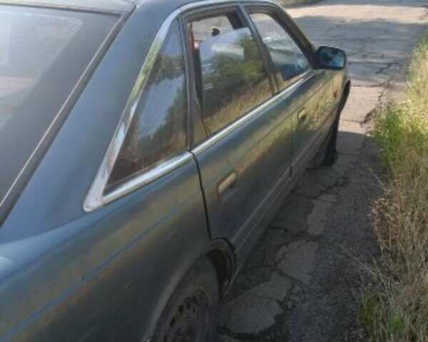 Синий Мазда 626, объемом двигателя 2 л и пробегом 300 тыс. км за 650 $, фото 5 на Automoto.ua