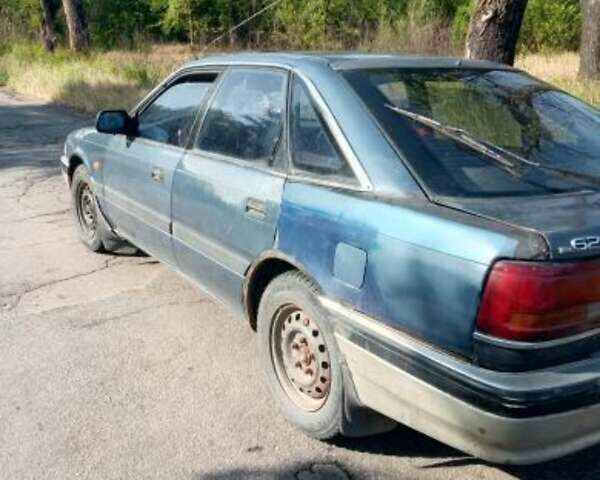Синий Мазда 626, объемом двигателя 2 л и пробегом 300 тыс. км за 650 $, фото 1 на Automoto.ua