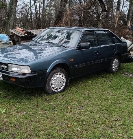 Синий Мазда 626, объемом двигателя 2 л и пробегом 205 тыс. км за 600 $, фото 1 на Automoto.ua