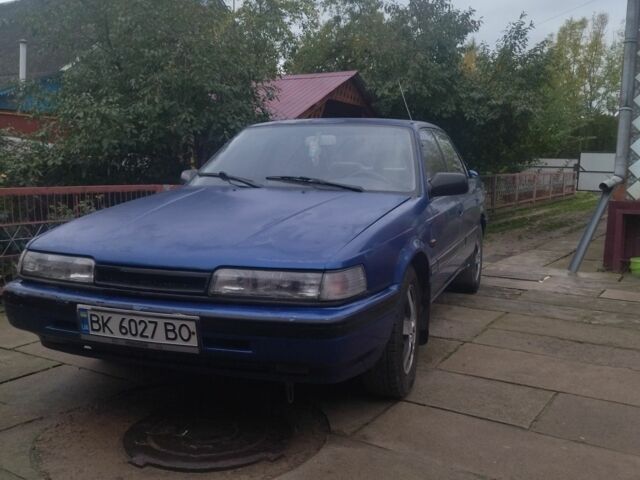 Синій Мазда 626, об'ємом двигуна 2 л та пробігом 273 тис. км за 899 $, фото 1 на Automoto.ua