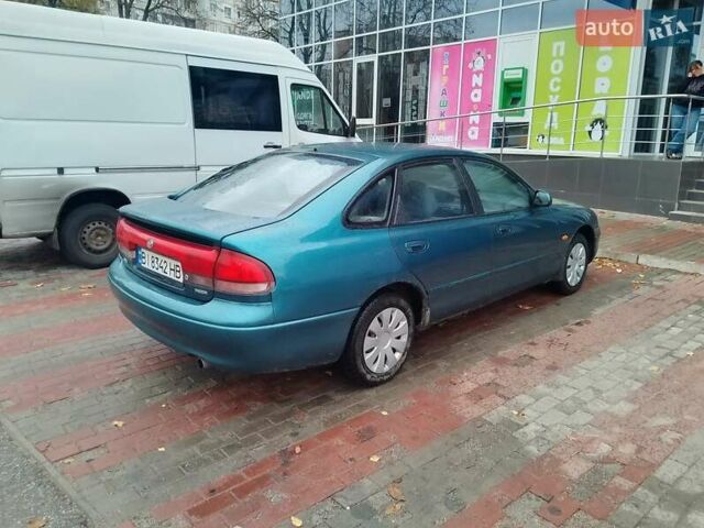 Синий Мазда 626, объемом двигателя 2 л и пробегом 393 тыс. км за 2033 $, фото 4 на Automoto.ua