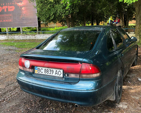 Синий Мазда 626, объемом двигателя 2 л и пробегом 400 тыс. км за 1500 $, фото 4 на Automoto.ua