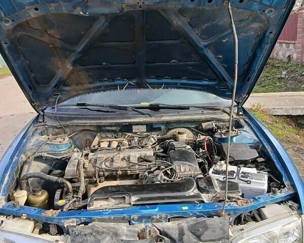 Синий Мазда 626, объемом двигателя 2 л и пробегом 491 тыс. км за 1999 $, фото 5 на Automoto.ua