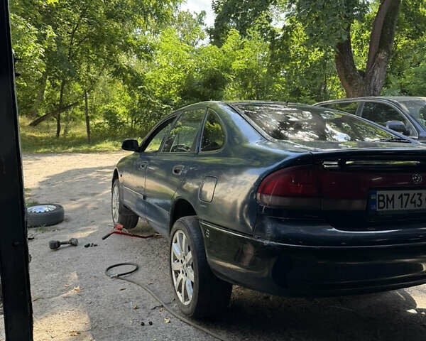 Синій Мазда 626, об'ємом двигуна 2 л та пробігом 300 тис. км за 1900 $, фото 21 на Automoto.ua