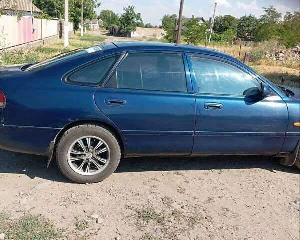 Синий Мазда 626, объемом двигателя 1.8 л и пробегом 300 тыс. км за 2100 $, фото 3 на Automoto.ua