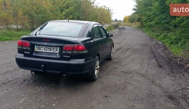 Синий Мазда 626, объемом двигателя 1.8 л и пробегом 319 тыс. км за 2300 $, фото 9 на Automoto.ua