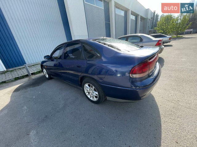 Синий Мазда 626, объемом двигателя 2.5 л и пробегом 341 тыс. км за 2800 $, фото 3 на Automoto.ua