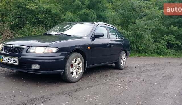 Синий Мазда 626, объемом двигателя 1.8 л и пробегом 319 тыс. км за 2300 $, фото 6 на Automoto.ua