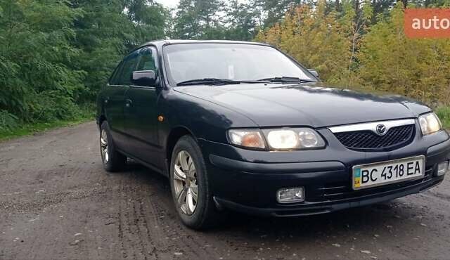 Синий Мазда 626, объемом двигателя 1.8 л и пробегом 319 тыс. км за 2300 $, фото 2 на Automoto.ua
