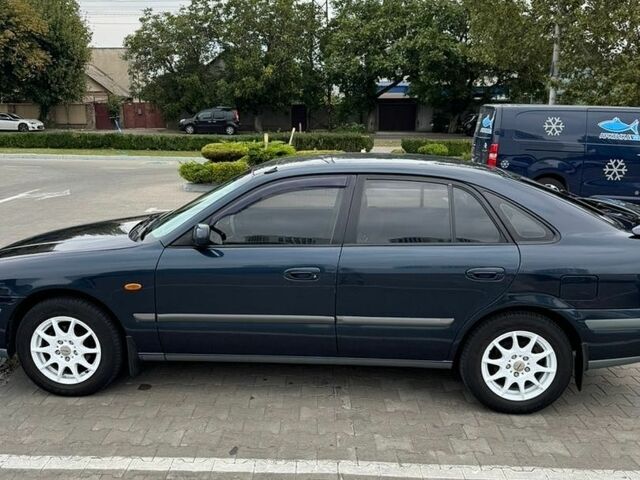 Синий Мазда 626, объемом двигателя 2 л и пробегом 312 тыс. км за 3650 $, фото 3 на Automoto.ua