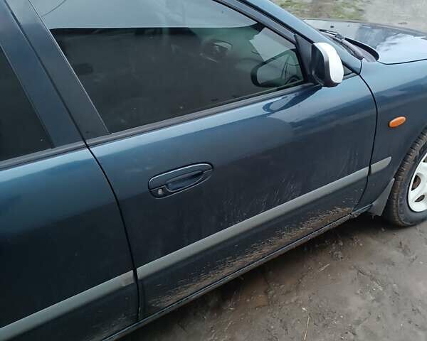 Синий Мазда 626, объемом двигателя 2 л и пробегом 280 тыс. км за 2000 $, фото 12 на Automoto.ua