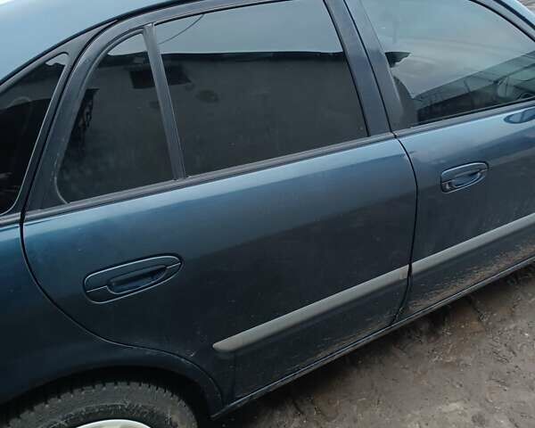 Синий Мазда 626, объемом двигателя 2 л и пробегом 280 тыс. км за 2000 $, фото 11 на Automoto.ua