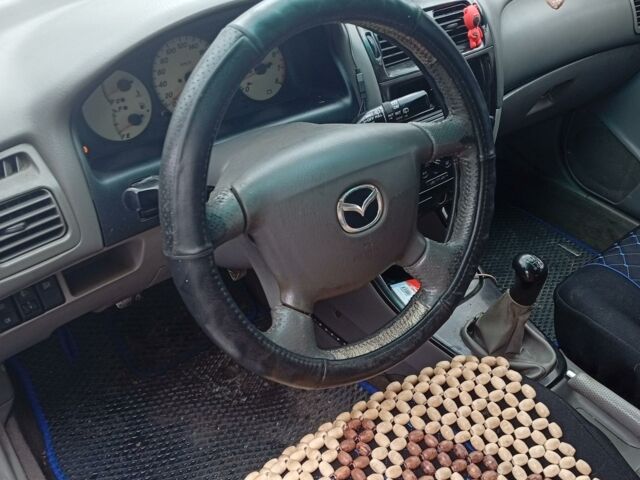 Синий Мазда 626, объемом двигателя 2 л и пробегом 145 тыс. км за 29 $, фото 4 на Automoto.ua