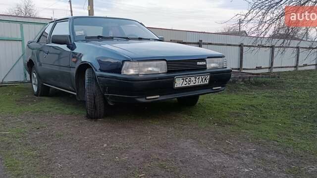 Синий Мазда 626, объемом двигателя 2 л и пробегом 370 тыс. км за 950 $, фото 3 на Automoto.ua