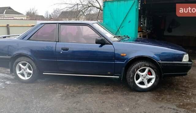 Синий Мазда 626, объемом двигателя 2 л и пробегом 370 тыс. км за 950 $, фото 9 на Automoto.ua