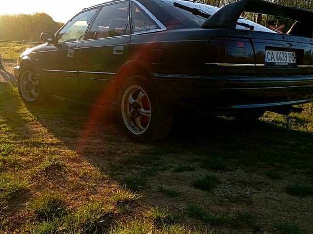 Синий Мазда 626, объемом двигателя 2 л и пробегом 350 тыс. км за 1200 $, фото 2 на Automoto.ua