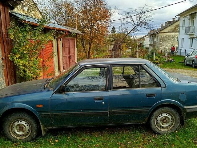 Синий Мазда 626, объемом двигателя 1.6 л и пробегом 380 тыс. км за 300 $, фото 1 на Automoto.ua