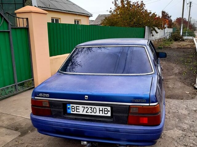 Синий Мазда 626, объемом двигателя 2 л и пробегом 403 тыс. км за 1000 $, фото 1 на Automoto.ua