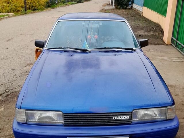 Синий Мазда 626, объемом двигателя 2 л и пробегом 403 тыс. км за 1000 $, фото 2 на Automoto.ua