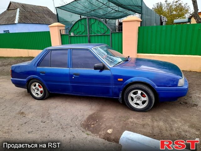 Синий Мазда 626, объемом двигателя 2 л и пробегом 403 тыс. км за 1000 $, фото 3 на Automoto.ua