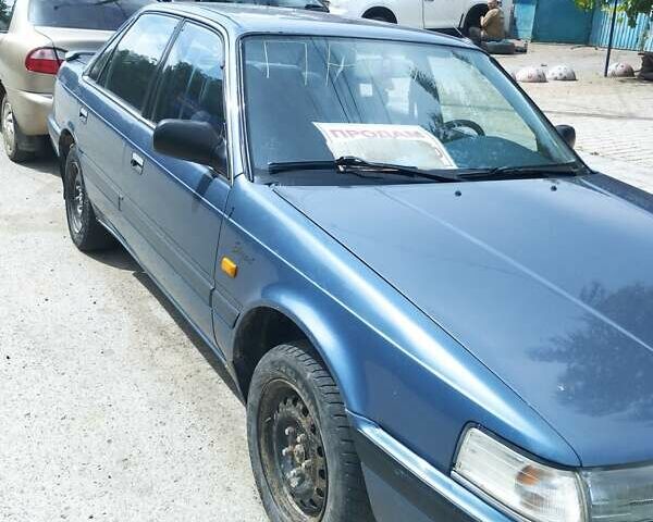 Синий Мазда 626, объемом двигателя 1.99 л и пробегом 299 тыс. км за 1399 $, фото 1 на Automoto.ua