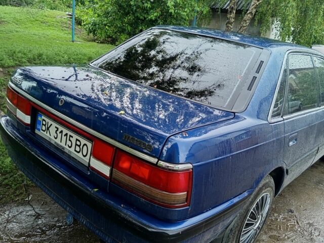 Синий Мазда 626, объемом двигателя 1.8 л и пробегом 300 тыс. км за 1300 $, фото 1 на Automoto.ua