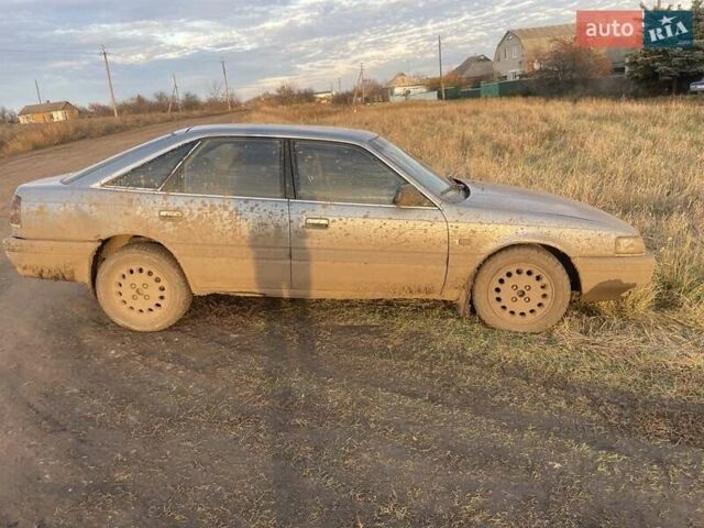 Синій Мазда 626, об'ємом двигуна 2 л та пробігом 300 тис. км за 714 $, фото 4 на Automoto.ua