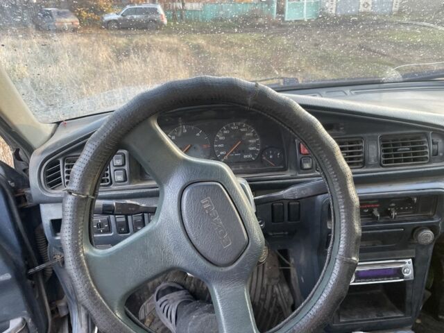Синій Мазда 626, об'ємом двигуна 2 л та пробігом 300 тис. км за 714 $, фото 8 на Automoto.ua